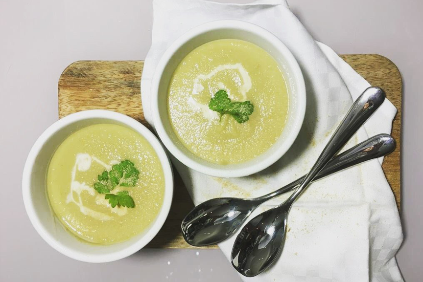 fennel and celeriac soup in bowls with spoons.