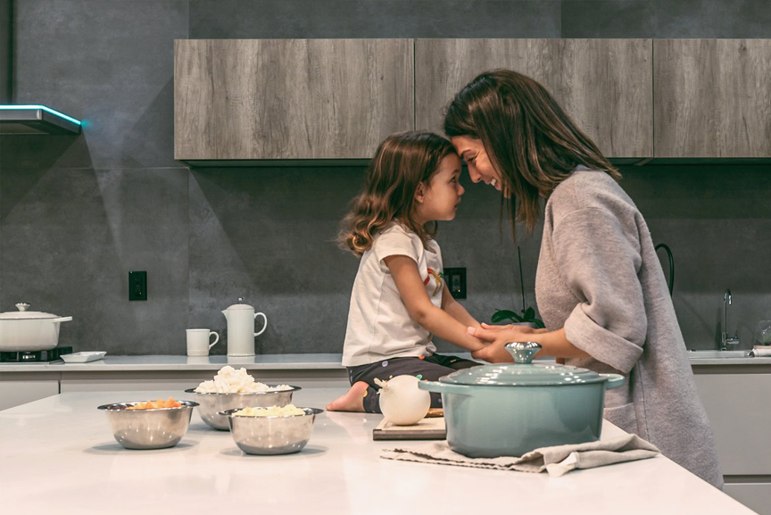 Mom and daughter in kitchen.