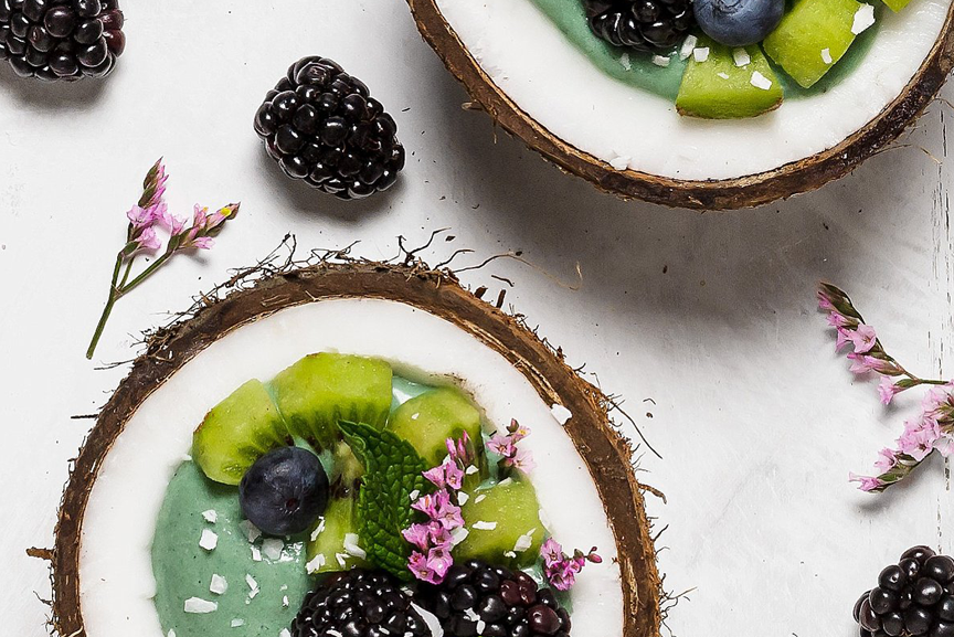 Kiwi smoothie bowls in coconut shells