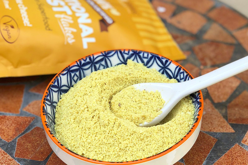 Nutritional yeast flakes in a bowl.