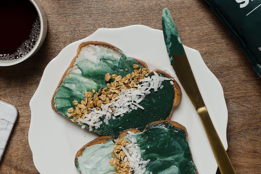Two pieces of Spirulina toastier on a plate